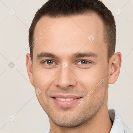 Joyful white young-adult male with short  brown hair and brown eyes