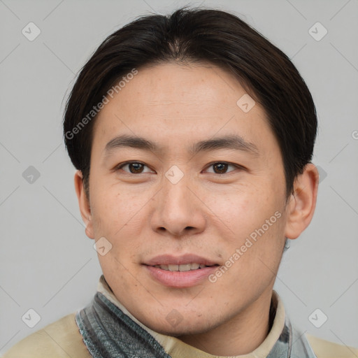 Joyful asian young-adult male with short  brown hair and brown eyes