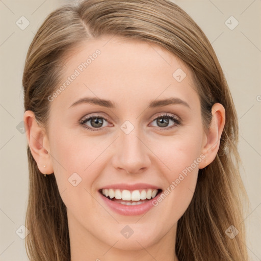 Joyful white young-adult female with long  brown hair and blue eyes