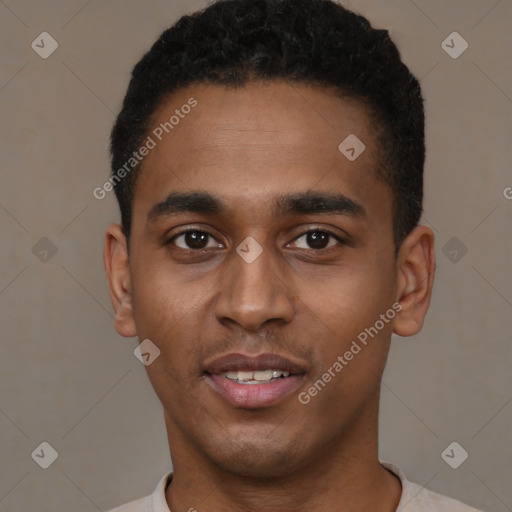 Joyful black young-adult male with short  black hair and brown eyes