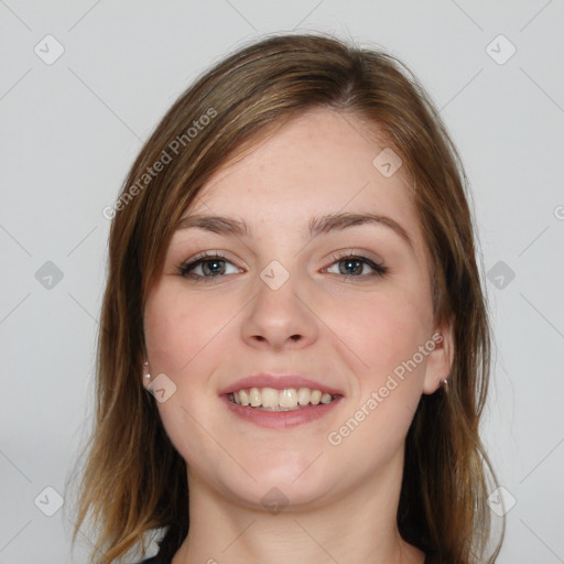 Joyful white young-adult female with medium  brown hair and blue eyes