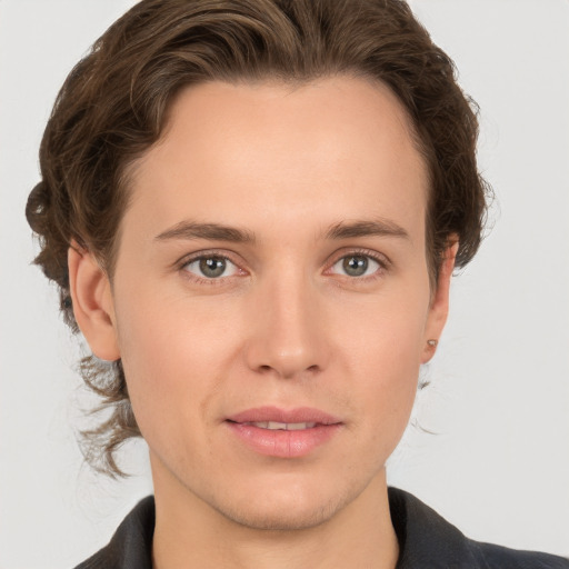 Joyful white young-adult male with medium  brown hair and grey eyes