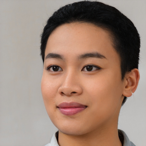Joyful asian young-adult female with short  black hair and brown eyes