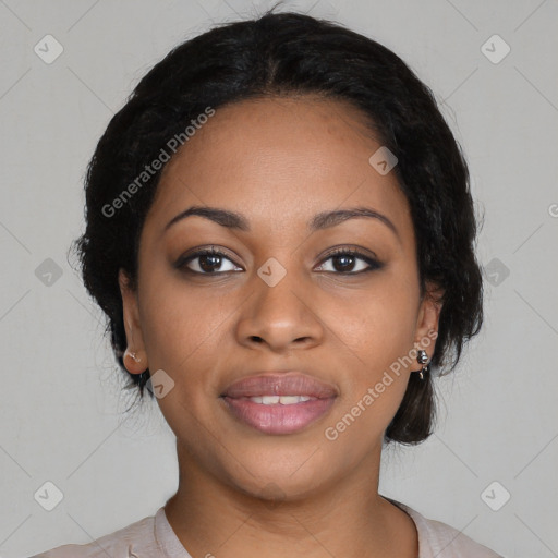 Joyful black young-adult female with medium  black hair and brown eyes