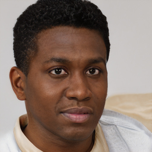 Neutral black young-adult male with short  brown hair and brown eyes