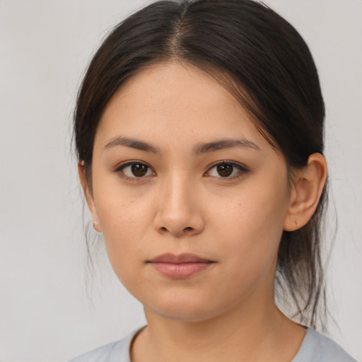 Neutral asian young-adult female with medium  brown hair and brown eyes