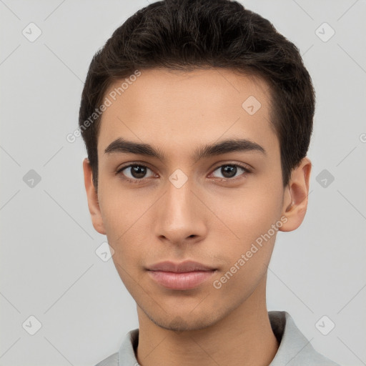 Neutral white young-adult male with short  brown hair and brown eyes