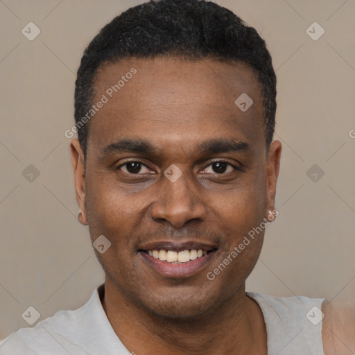 Joyful black young-adult male with short  black hair and brown eyes