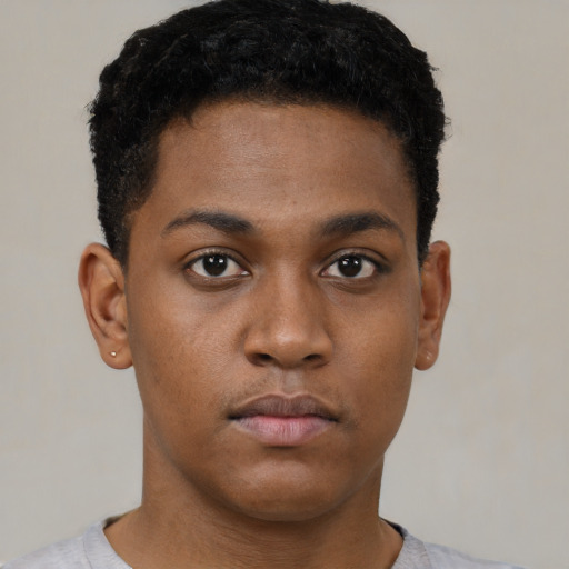 Neutral black young-adult male with short  black hair and brown eyes