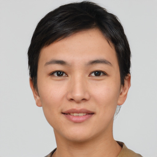 Joyful asian young-adult female with short  black hair and brown eyes