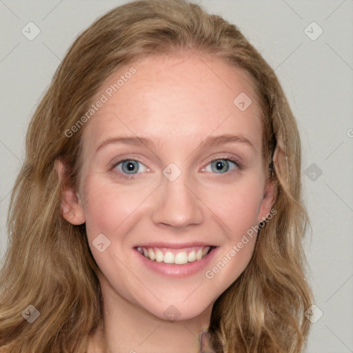 Joyful white young-adult female with long  brown hair and blue eyes