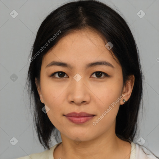 Joyful asian young-adult female with medium  black hair and brown eyes