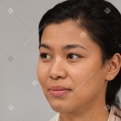 Joyful latino young-adult female with short  brown hair and brown eyes