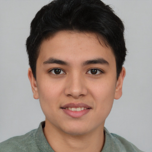 Joyful asian young-adult male with short  brown hair and brown eyes