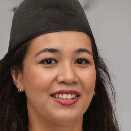 Joyful asian young-adult female with long  brown hair and brown eyes