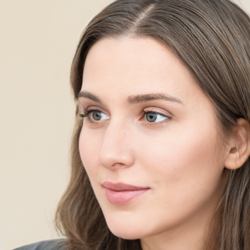 Neutral white young-adult female with long  brown hair and grey eyes