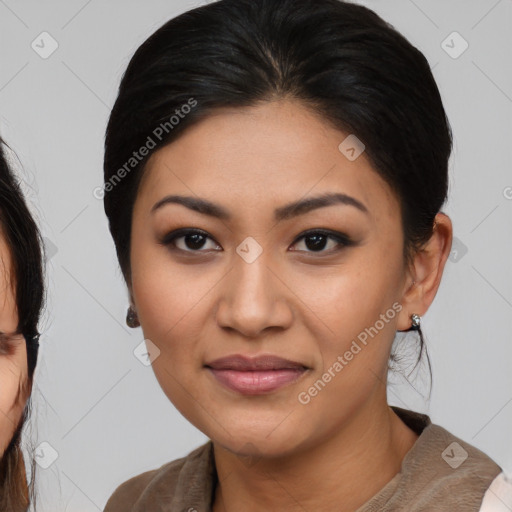 Joyful latino young-adult female with medium  brown hair and brown eyes