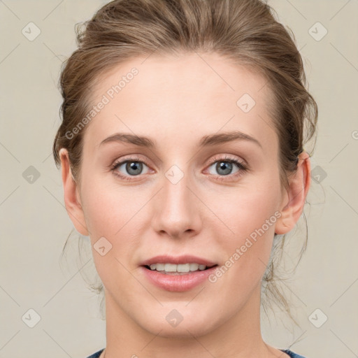 Joyful white young-adult female with medium  brown hair and blue eyes