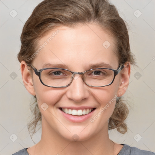 Joyful white young-adult female with medium  brown hair and blue eyes