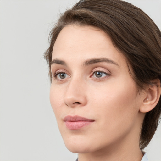 Neutral white young-adult female with medium  brown hair and grey eyes