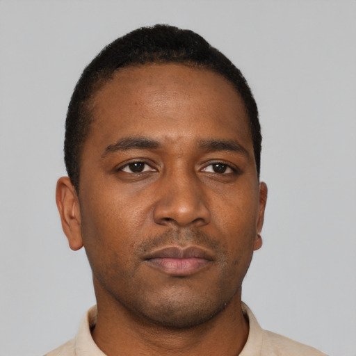 Neutral black young-adult male with short  black hair and brown eyes