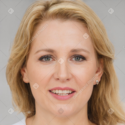 Joyful white adult female with medium  brown hair and blue eyes