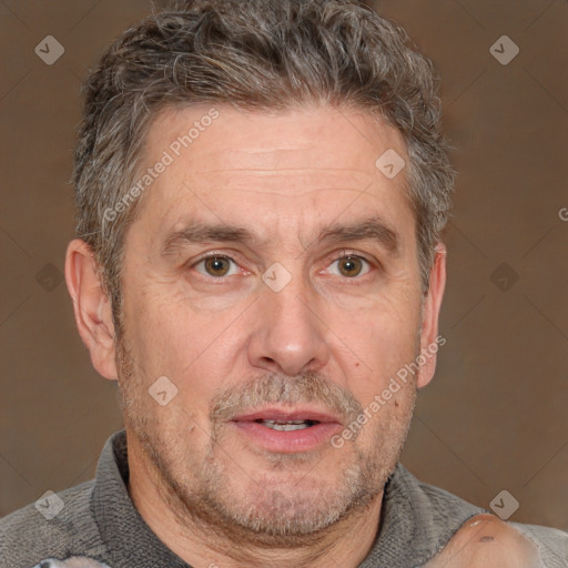 Joyful white middle-aged male with short  brown hair and brown eyes