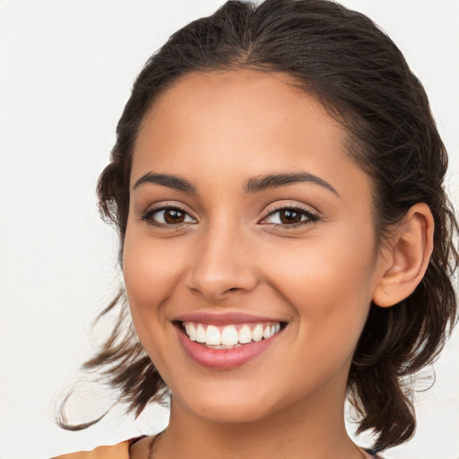 Joyful white young-adult female with long  brown hair and brown eyes