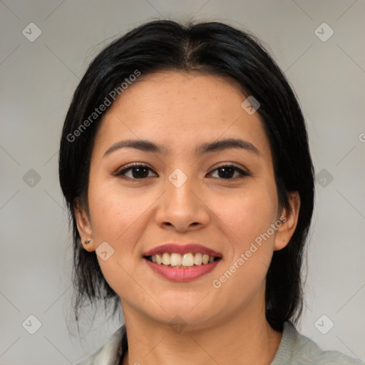 Joyful asian young-adult female with medium  black hair and brown eyes