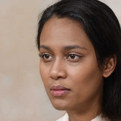 Neutral black young-adult female with medium  black hair and brown eyes