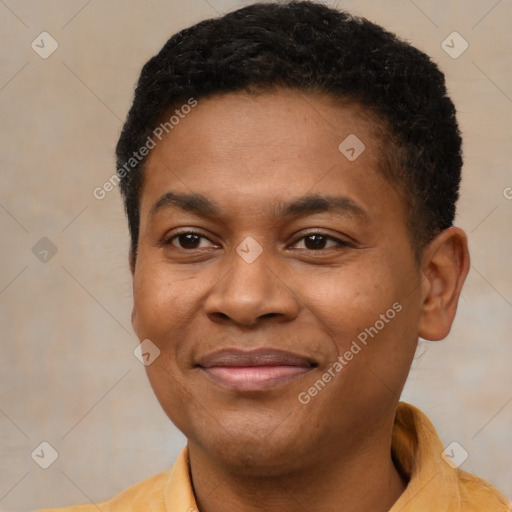 Joyful black young-adult male with short  brown hair and brown eyes