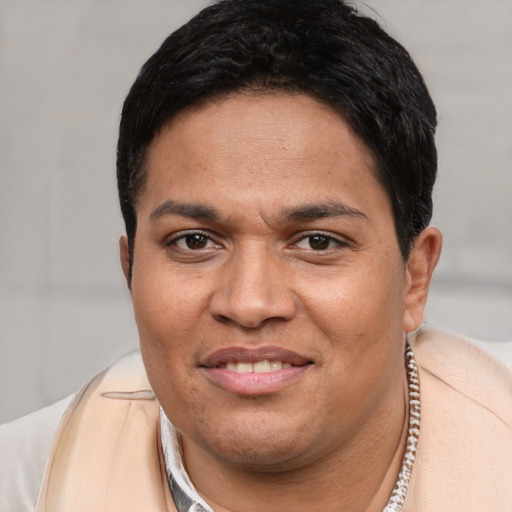 Joyful white young-adult male with short  black hair and brown eyes