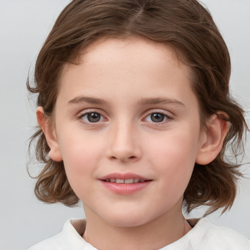 Joyful white child female with medium  brown hair and brown eyes