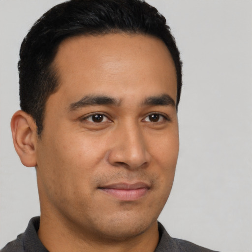 Neutral latino young-adult male with short  black hair and brown eyes