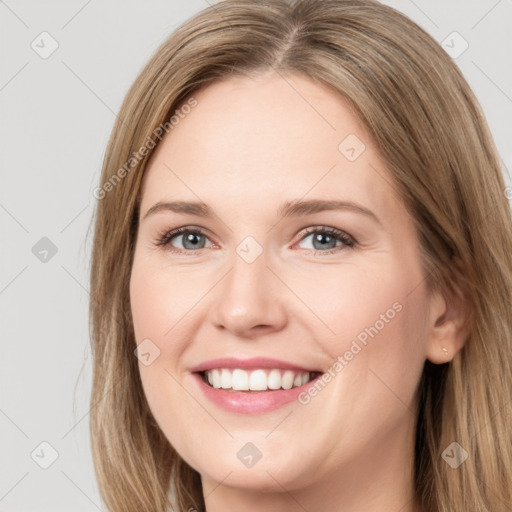 Joyful white young-adult female with long  brown hair and green eyes