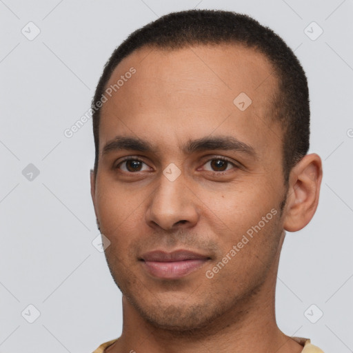 Joyful white young-adult male with short  black hair and brown eyes