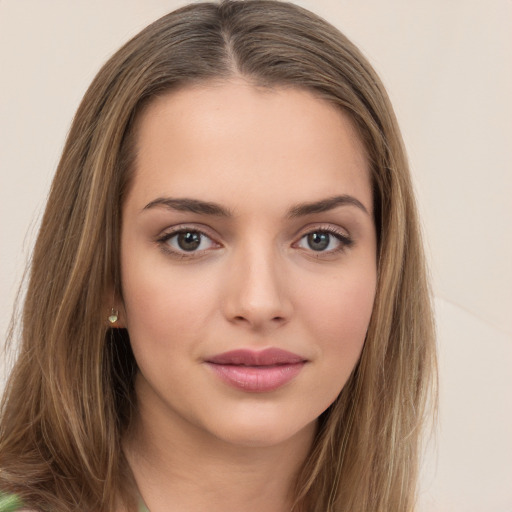 Neutral white young-adult female with long  brown hair and green eyes