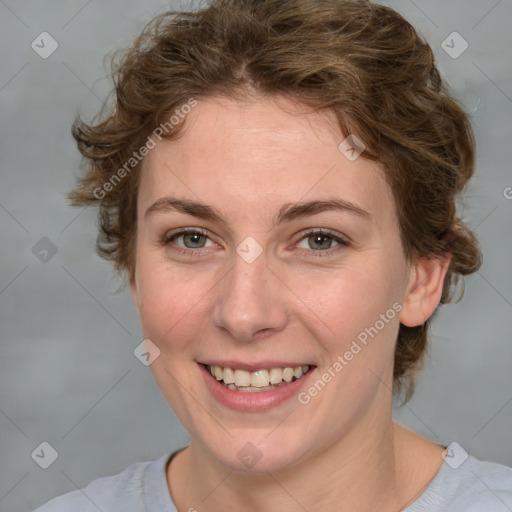 Joyful white young-adult female with medium  brown hair and blue eyes