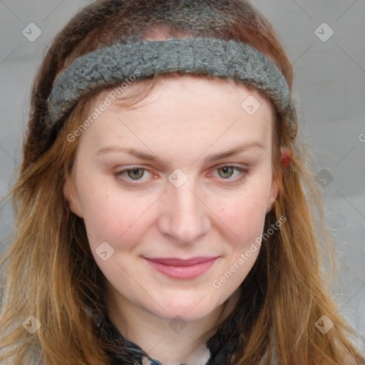 Joyful white young-adult female with long  brown hair and blue eyes