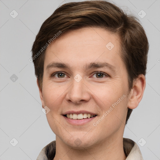 Joyful white young-adult male with short  brown hair and grey eyes