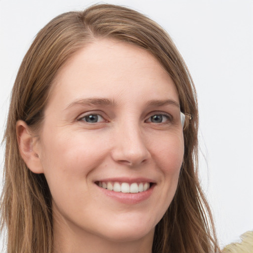 Joyful white young-adult female with long  brown hair and grey eyes