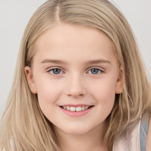 Joyful white child female with long  brown hair and grey eyes