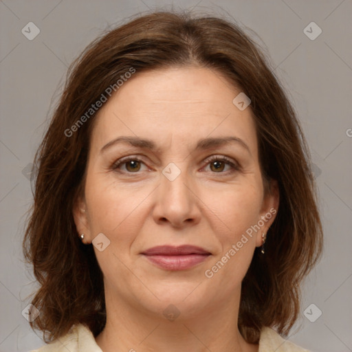 Joyful white adult female with medium  brown hair and brown eyes