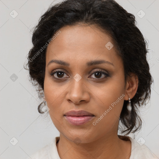 Joyful black young-adult female with medium  brown hair and brown eyes