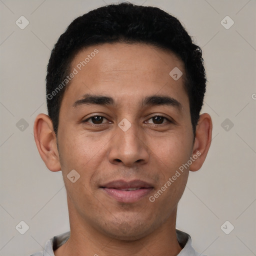 Joyful latino young-adult male with short  black hair and brown eyes