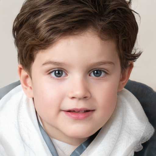 Joyful white child male with short  brown hair and blue eyes