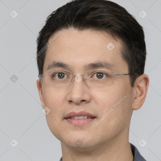 Joyful white young-adult male with short  black hair and brown eyes