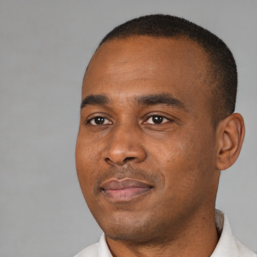 Neutral black young-adult male with short  black hair and brown eyes