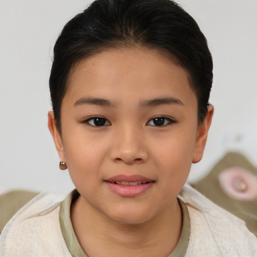 Joyful asian child female with short  brown hair and brown eyes