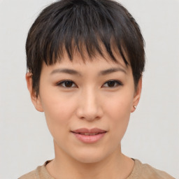 Joyful asian young-adult female with short  brown hair and brown eyes